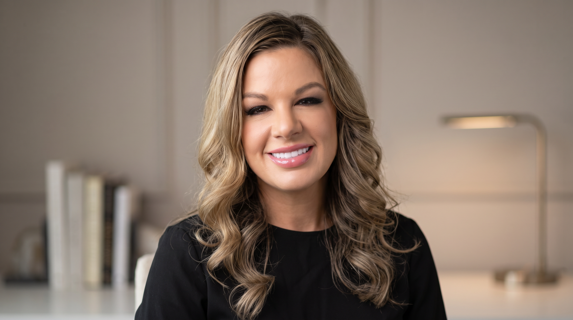 Cheryl Gleason, trained perfumer and founder of Glitters & Grace, at a corporate event station