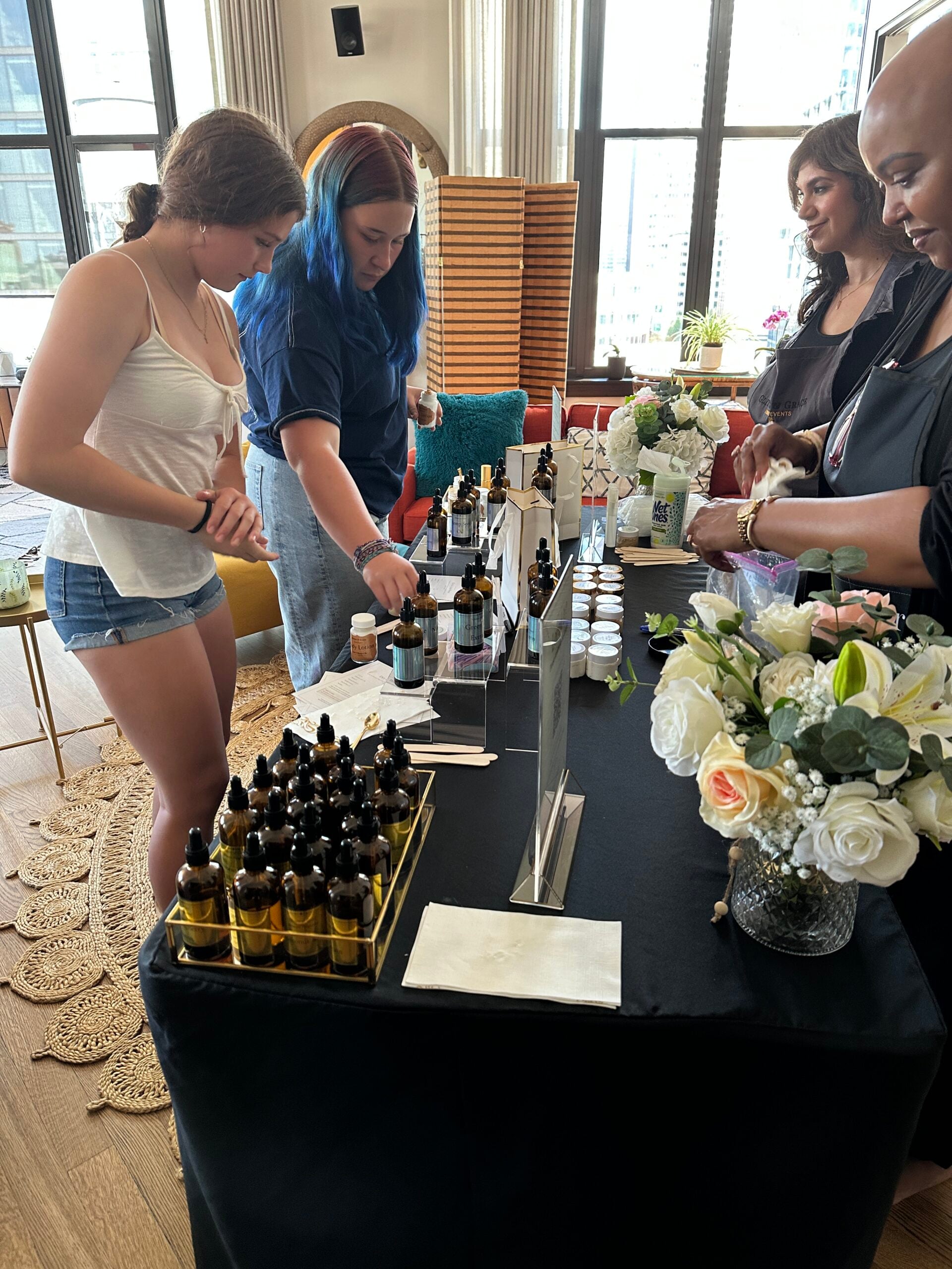 The five products a guest makes at a Glitters and Grace skincare bar: facial moisturizer, face and body butter, body lotion, exfoliating scrub and a 15 ml body spray