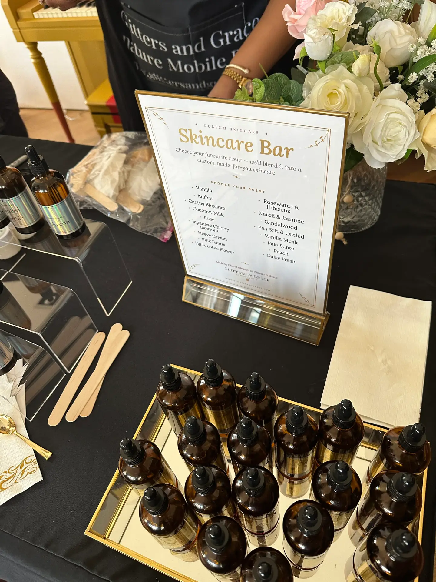 Skincare bar sign with amber bottles