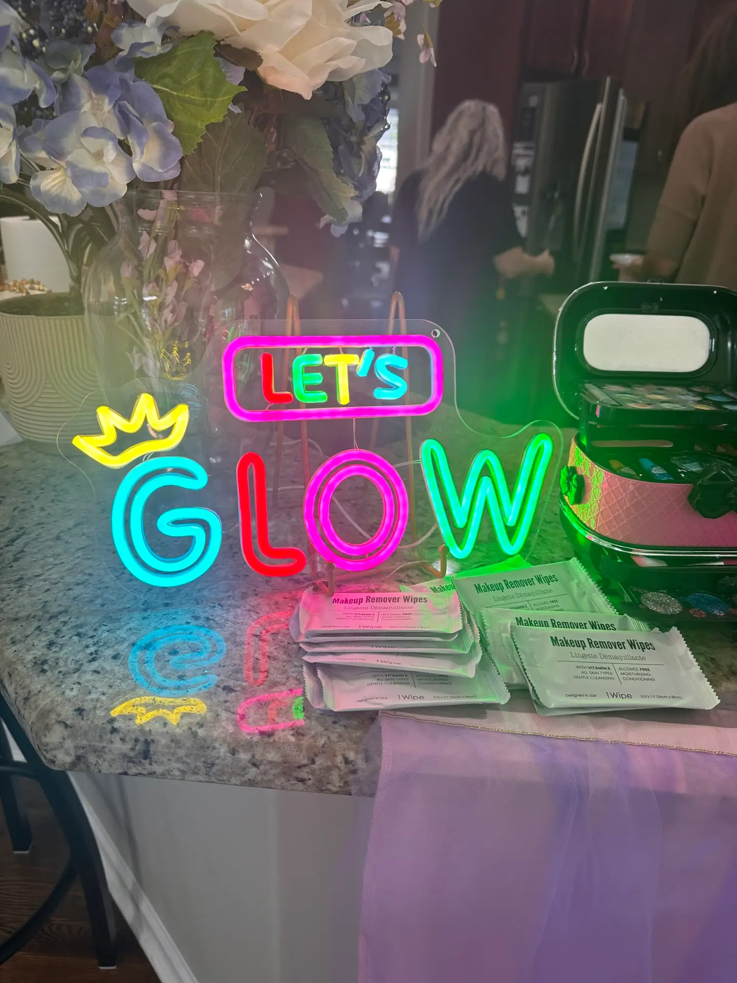 Tweens using a glitter and glow kit at a tween party in Zionsville