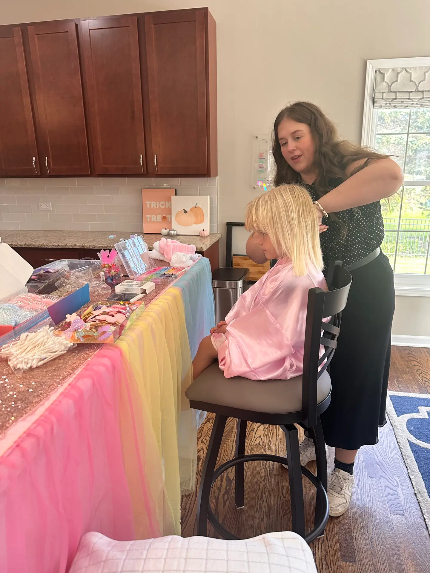 Host helping guests at a custom skincare bar