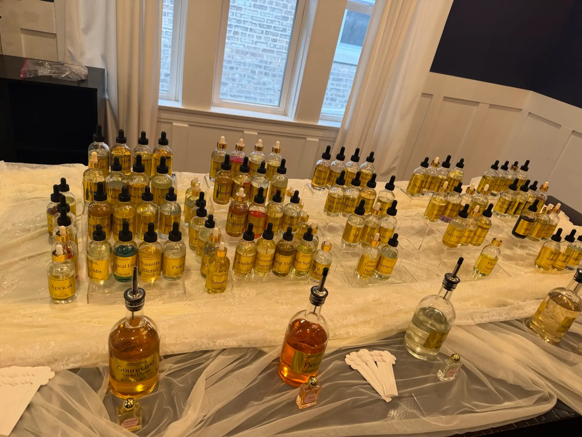 Absolutes, CO2 extracts and essential oils in amber bottles, the raw materials used at a Glitters and Grace perfume bar