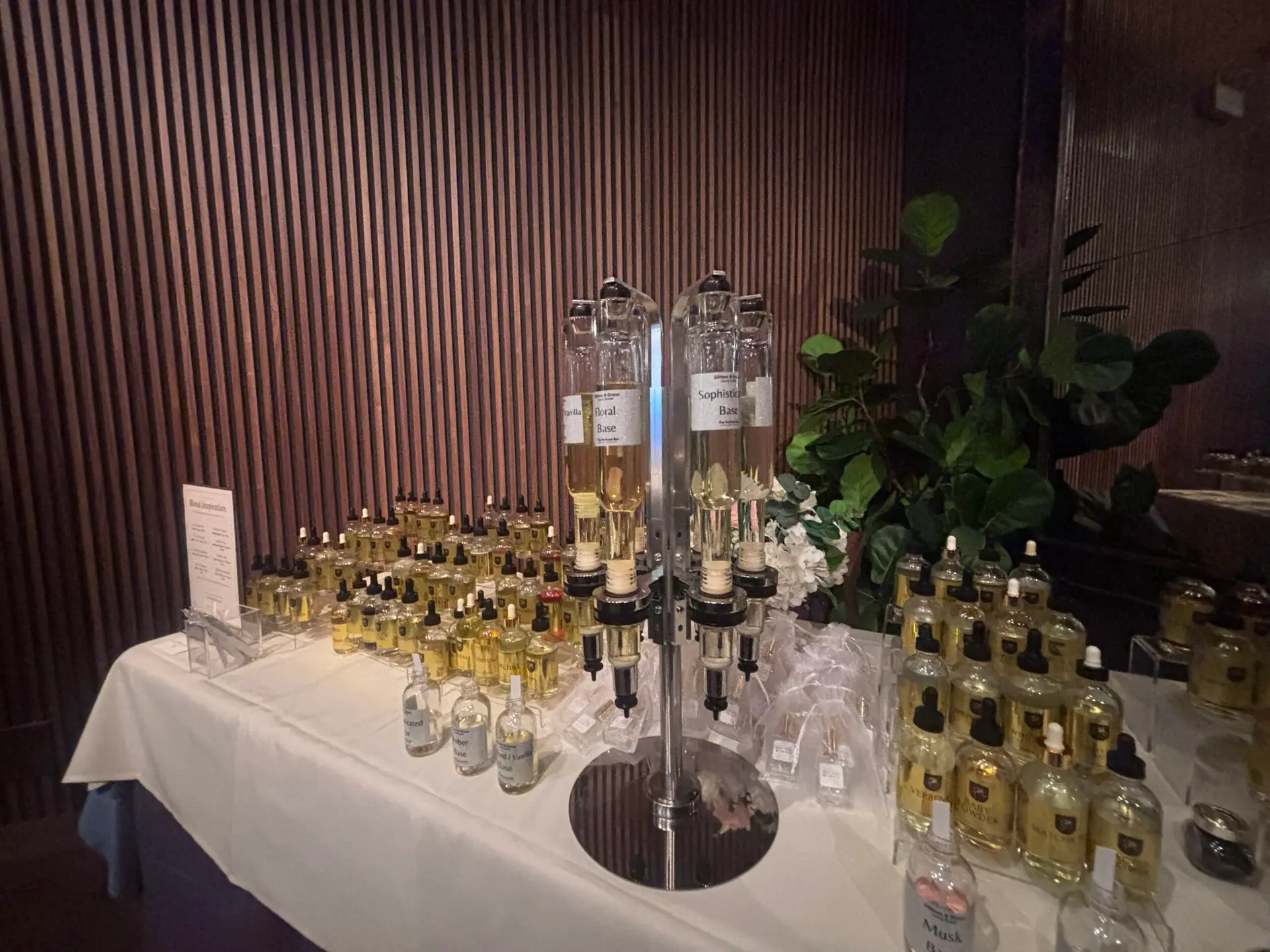 Event perfume bar with rows of fragrance bottles