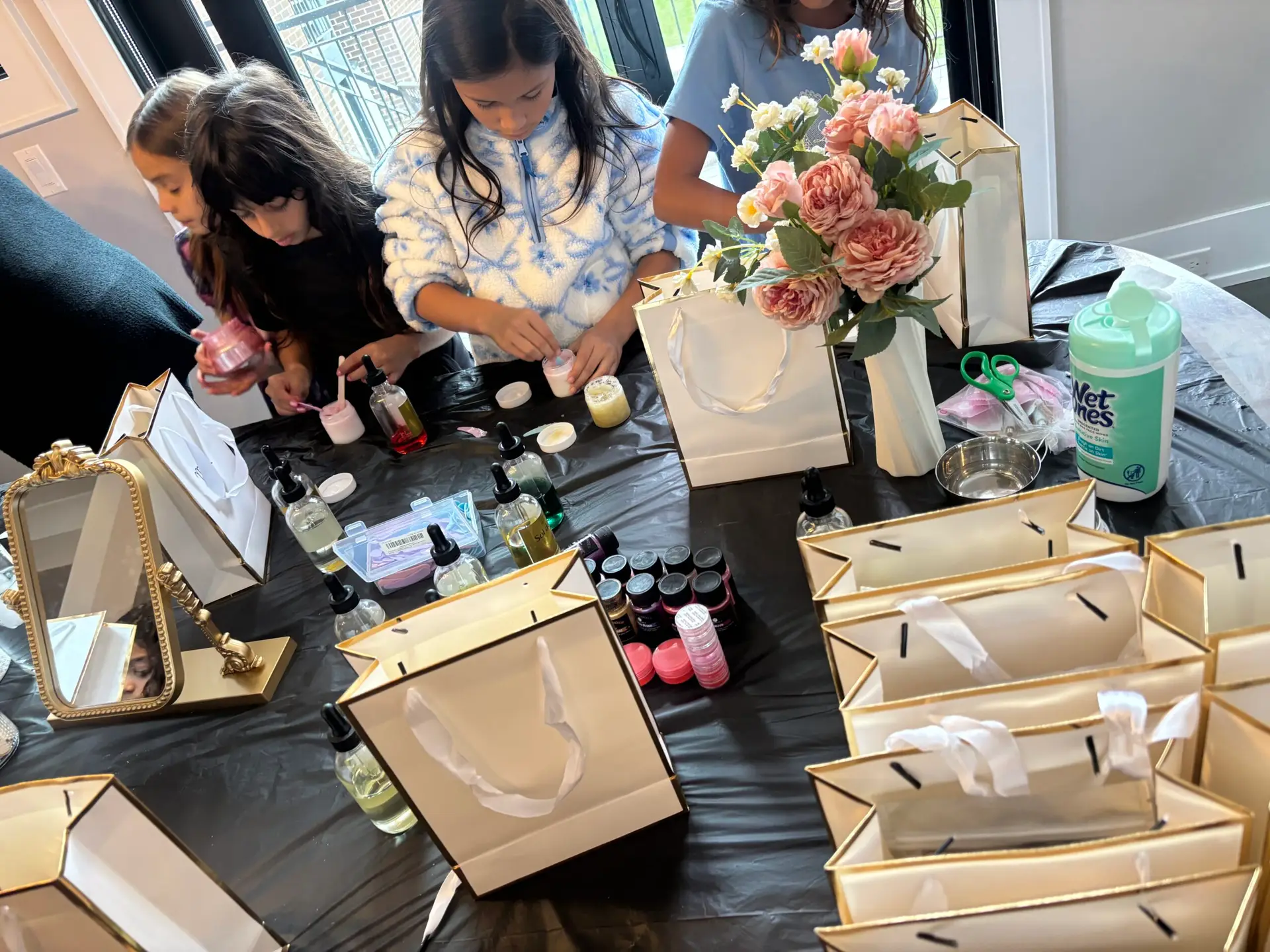Teens trying a skincare bar during a birthday sleepover