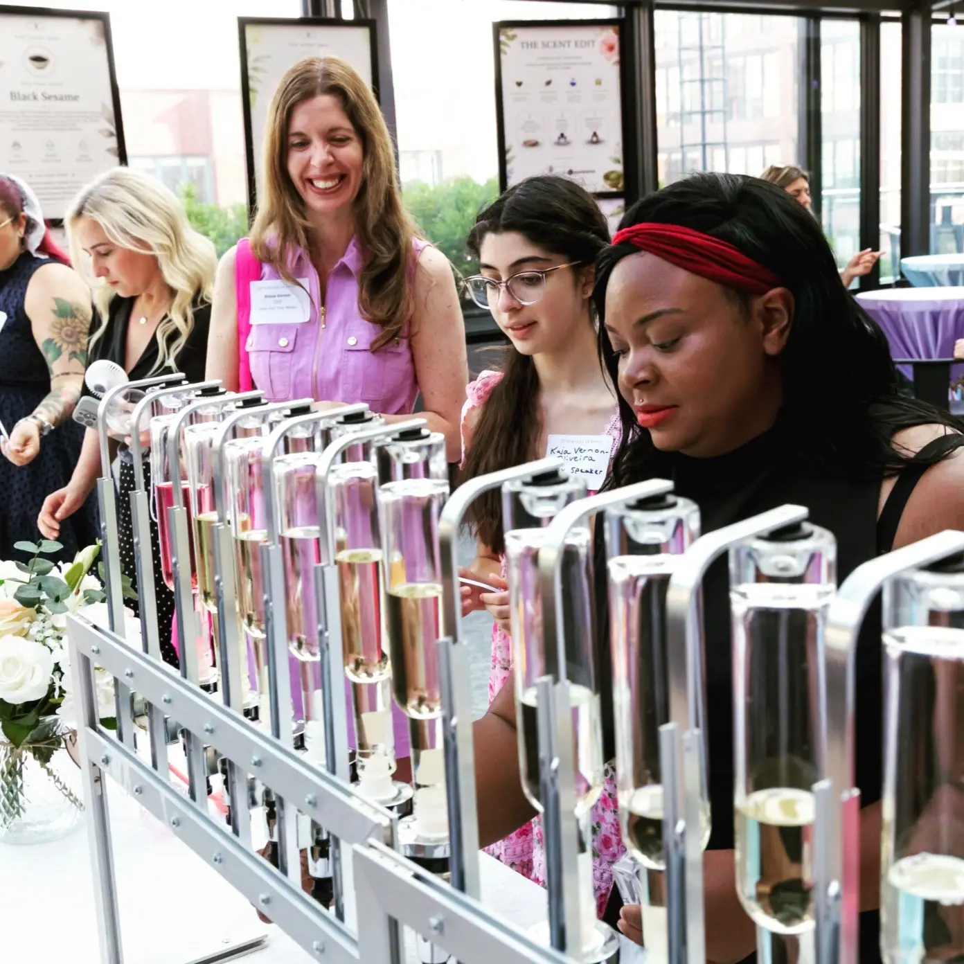 Perfume bar signage and display styled for a company event