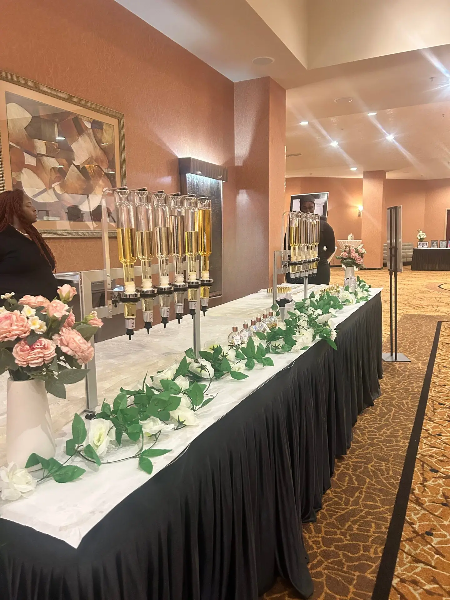 Guests at a wedding perfume bar